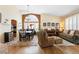 Open-concept living space featuring hardwood floors, ample natural light, and stylish decor at 1410 Exquisite St, Castle Rock, CO 80109