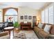 Comfortable living space with natural light, hardwood floors, and stylish furnishings at 1410 Exquisite St, Castle Rock, CO 80109