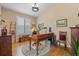 Cozy office space with a vintage desk, bright window and custom storage at 1410 Exquisite St, Castle Rock, CO 80109