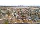 An aerial view of houses in a neighborhood with mature trees lining the streets at 2020 Gray St, Edgewater, CO 80214