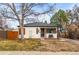 Charming single-story home with neutral siding, dark roof, and mature trees at 2020 Gray St, Edgewater, CO 80214