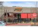 A Adelitas Cocina Y Cantina restaurant front features wood and red accents, creating a vibrant dining experience at 2020 Gray St, Edgewater, CO 80214