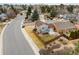 Aerial view of a home featuring a small deck, spacious backyard, wooden fence in a peaceful residential neighborhood at 11404 E Yale Pl, Aurora, CO 80014