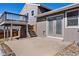 Concrete patio leading to a two-story deck for outdoor enjoyment and fenced yard at 11404 E Yale Pl, Aurora, CO 80014