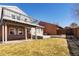 Well-sized backyard with lush grass, concrete patio and a small deck for outdoor entertainment and relaxation at 11404 E Yale Pl, Aurora, CO 80014