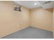 Basement space with painted concrete floors and egress window at 11404 E Yale Pl, Aurora, CO 80014