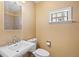 Bathroom with white fixtures and a large shower reflection at 11404 E Yale Pl, Aurora, CO 80014