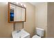 Bathroom with vanity sink, decorative tile accents and neutral paint at 11404 E Yale Pl, Aurora, CO 80014