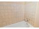 Bathroom with tiled tub/shower and neutral colors at 11404 E Yale Pl, Aurora, CO 80014