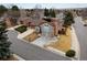 Charming two-story home featuring an attached two-car garage and a well-manicured front yard with a long driveway at 11404 E Yale Pl, Aurora, CO 80014