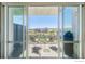 This balcony features outdoor seating and expansive city views at 1401 Wewatta St # 714, Denver, CO 80202