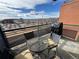 Cozy outdoor patio featuring a table and chairs with views of the city at 1401 Wewatta St # 714, Denver, CO 80202