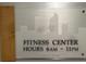 Fitness Center hours are displayed on a modern sign at 1401 Wewatta St # 714, Denver, CO 80202