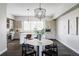 Bright dining area featuring modern chandelier and stylish decor at 5036 S Platte River Pkwy, Littleton, CO 80123