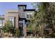 Striking modern exterior with a mix of brick and siding creating unique architectural appeal in a lovely community at 5036 S Platte River Pkwy, Littleton, CO 80123