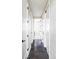 Hallway with many closet doors and wooden floors, providing a clean and organized look at 5036 S Platte River Pkwy, Littleton, CO 80123