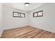 Cozy bedroom with beautiful wood floors, white walls, and plenty of natural light at 10600 E 25Th Ave, Aurora, CO 80010