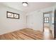 Bright bedroom featuring hardwood floors, a window, a closet, and white paint at 10600 E 25Th Ave, Aurora, CO 80010