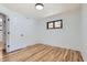 Bright bedroom featuring hardwood floors, a window, and white walls at 10600 E 25Th Ave, Aurora, CO 80010