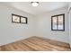 Bedroom with hardwood floors, white walls, and a window at 10600 E 25Th Ave, Aurora, CO 80010