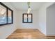 Bright dining room with wood floors, stylish lighting, and plenty of natural light at 10600 E 25Th Ave, Aurora, CO 80010