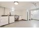 Functional laundry area with stainless steel sink, storage, and modern washer and dryer setup at 10600 E 25Th Ave, Aurora, CO 80010