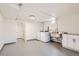 Clean laundry room with modern appliances, ample counter space, and white cabinetry for storage at 10600 E 25Th Ave, Aurora, CO 80010