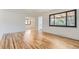 Open living room with beautiful hardwood floors, modern finishes, and abundant natural light at 10600 E 25Th Ave, Aurora, CO 80010