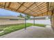 Covered patio overlooking a well-maintained yard, perfect for outdoor entertaining and relaxation at 10600 E 25Th Ave, Aurora, CO 80010