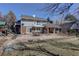 Expansive backyard featuring a large patio area and a playset at 9526 E Lake Ave, Greenwood Village, CO 80111