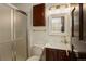 Modern bathroom featuring a glass-enclosed shower, vanity with sink, marble countertop, and stylish mirror, creating a luxurious retreat at 9526 E Lake Ave, Greenwood Village, CO 80111