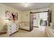 Comfortable room featuring natural light, daybed, and soft carpet perfect for relaxation at 9526 E Lake Ave, Greenwood Village, CO 80111