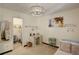 Bright bedroom featuring soft colors, large window with curtains, and decorative artwork, creating a relaxing ambiance at 9526 E Lake Ave, Greenwood Village, CO 80111