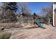Backyard playset area with slide, swings and trampoline at 9526 E Lake Ave, Greenwood Village, CO 80111