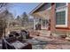Cozy covered porch with comfortable seating and stylish accents at 9526 E Lake Ave, Greenwood Village, CO 80111