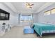 Bright bedroom with lots of natural light, a ceiling fan, and neutral carpeting at 3967 Eastout Ave, Parker, CO 80138