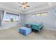 Light bedroom with lots of natural light, a ceiling fan, and neutral carpeting at 3967 Eastout Ave, Parker, CO 80138