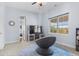 This bedroom offers a comfortable seating area and plenty of natural light at 3967 Eastout Ave, Parker, CO 80138
