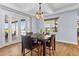 Bright dining room with a marble table set and outdoor access at 3967 Eastout Ave, Parker, CO 80138