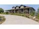 Attractive two-story home with a covered porch, complemented by a well-maintained driveway and landscaping at 3967 Eastout Ave, Parker, CO 80138