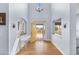 Bright foyer with high ceilings, featuring wood floors, and decorative details, creating an inviting entrance at 3967 Eastout Ave, Parker, CO 80138
