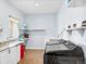 Spacious laundry room featuring granite countertop and ample shelving at 3967 Eastout Ave, Parker, CO 80138