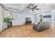 Spacious living room with a fireplace, hardwood floors, and a coffered ceiling at 3967 Eastout Ave, Parker, CO 80138