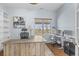 Home office space with two desks, a window view, and built-in shelving at 3967 Eastout Ave, Parker, CO 80138