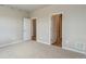 Spacious carpeted bedroom with walk-in closet and neutral paint at 48245 Shetland Dr, Bennett, CO 80102