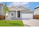 Charming single-Gathering home with a well-manicured lawn, attached two-car garage, and welcoming front porch at 48245 Shetland Dr, Bennett, CO 80102