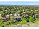Aerial view of the homes in the neighborhood with mature trees and lush acreage at 6388 Donner Cir, Parker, CO 80134