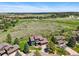 Aerial view of the home and surrounding properties with treed views and lush acreage at 6388 Donner Cir, Parker, CO 80134