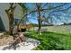 Backyard features a well maintained lawn, patio, deck, and mature trees at 6388 Donner Cir, Parker, CO 80134