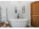 Beautiful bathroom featuring a freestanding tub, stylish fixtures, and elegant decor at 6388 Donner Cir, Parker, CO 80134